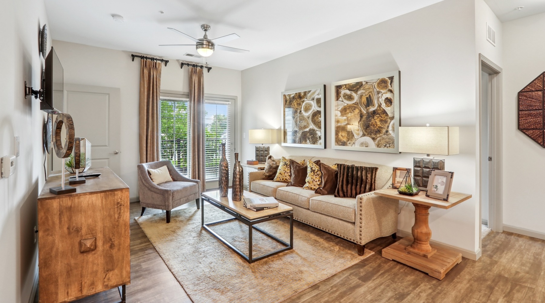 living room with a large window and open spaces