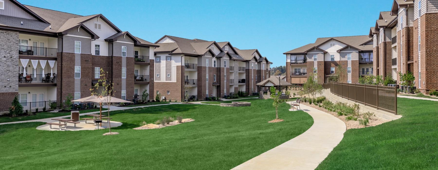 apartment buildings on green grass