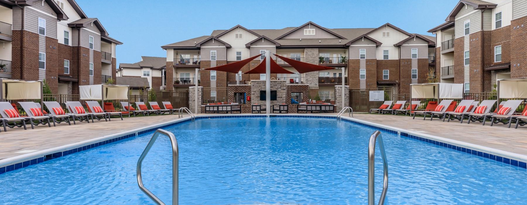 a swimming pool with a building in the background