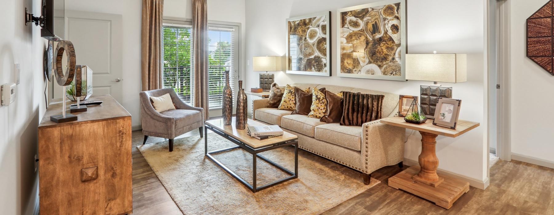 a living room with large windows and a couch