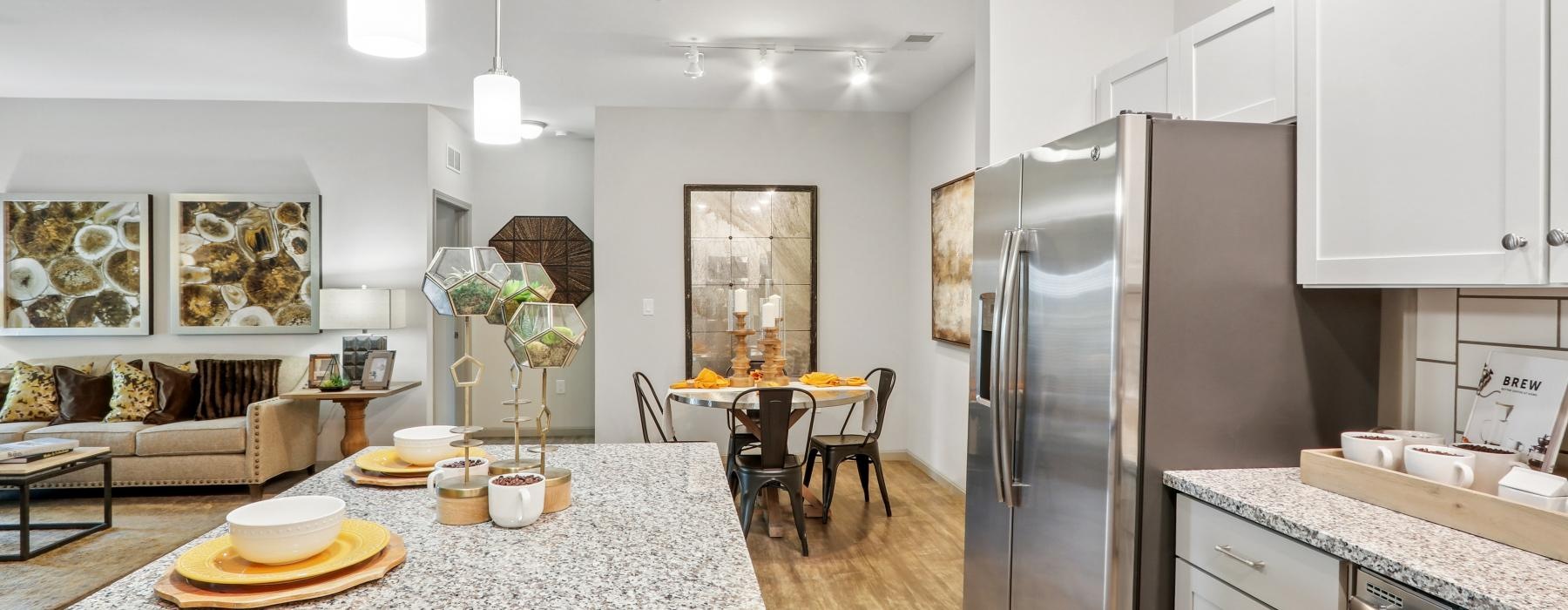 a kitchen with a table and chairs