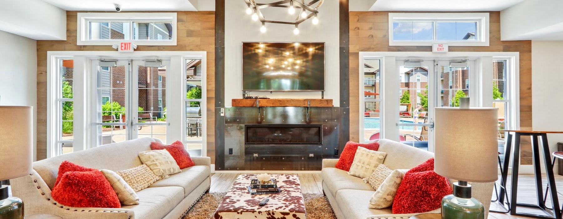 a spacious room with a fireplace and natural light