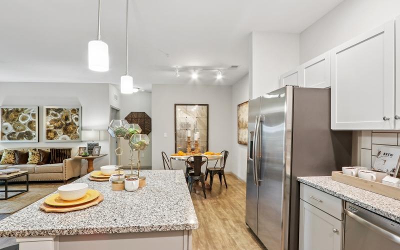 a kitchen with a table and chairs